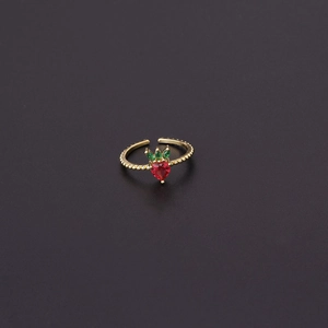 Macro shot of an adjustable gold ring featuring a red strawberry zircon with green leaves