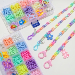 Macro view of colorful acrylic chain links and lobster clasps for DIY mask chain kit