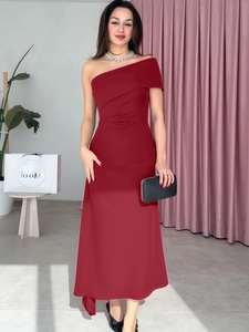 Detailed view of asymmetrical pleats and ruching on the wine red one-shoulder dress