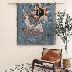 Bohemian sun and moon woven wall tapestry with floral motifs and tassel edges