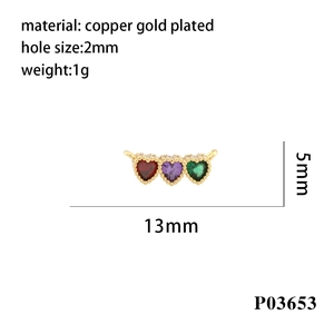 Close-up of 18K gold-plated heart pendant connector with red, purple, and green zircons