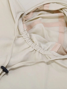 Detail view of quick-dry sun hat with breathable pink mesh lining and adjustable chin strap
