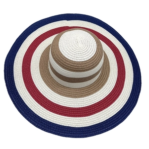Top view showing detailed circular weave texture and wide striped brim of sun hat