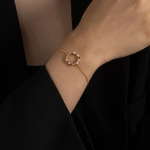 Elegant S925 sterling silver gold bracelet featuring a colorful gemstone floral wreath charm