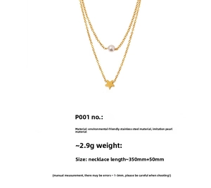 Detail of layered gold stainless steel necklace with white pearl and star pendant