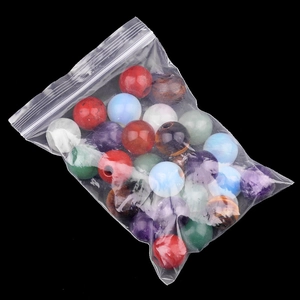 Mixed natural crystal agate large hole beads in a clear polybag for jewelry making