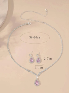 Detailed view of pink zircon teardrop necklace and earrings set with dimensions