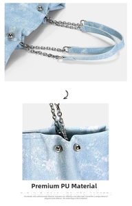Detail of light blue denim-textured PU leather bag with silver studs and chain strap