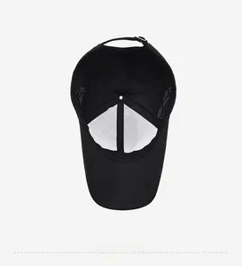 Inside view of black baseball cap showing breathable mesh holes and adjustable metal buckle