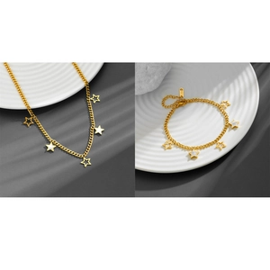 Macro view of gold stainless steel star necklace with white mother of pearl inlay