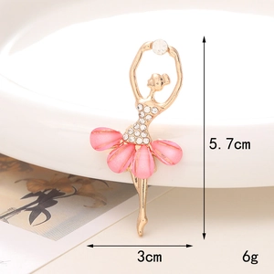 Macro view of a 5.7cm ballerina brooch with pink cat eye stones and white crystals