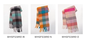 Detailed comparison of three plaid scarves with tassels in various color combinations
