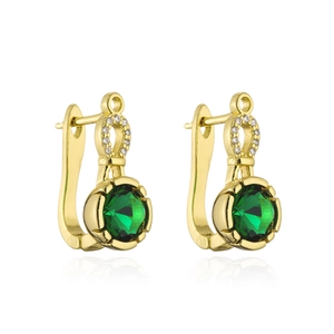 Detailed macro shot of 18K gold earrings featuring a round green gemstone and zircons