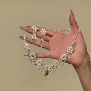 Elegant silver flower necklace and earring set with pearls and teardrop rhinestones