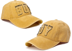 Detail of vintage washed cotton mustard yellow baseball cap with BOY embroidered patch