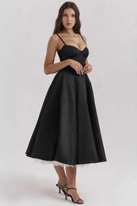 Close-up of elegant black princess dress showing double-layer mesh and satin finish texture