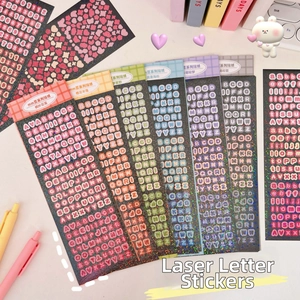 Macro detail of colorful laser alphabet stickers for DIY scrapbooking and idol card deco