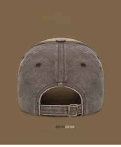 Detail of vintage washed cotton baseball cap featuring an adjustable metal buckle back closure