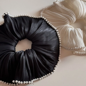 Elegant large pleated silk scrunchies with pearl trim in classic black and cream white