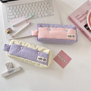 Minimalist high-capacity canvas pencil cases in pastel colors with heart buckle details