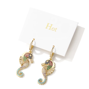 Gold plated seahorse hoop earrings featuring colorful cubic zirconia gemstones on a white card