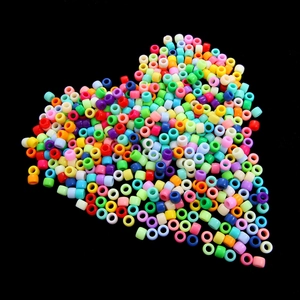 Colorful acrylic pony beads arranged in a heart shape for DIY jewelry making crafts