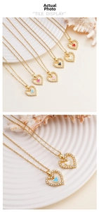 Close-up of heart pendants with pavé zircons in various colors on elegant shell decor