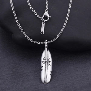 Detailed view of silver feather pendant necklace made of durable stainless steel