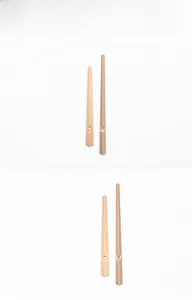Detail view of champagne gold metal clock hands for minimalist quartz wall clocks
