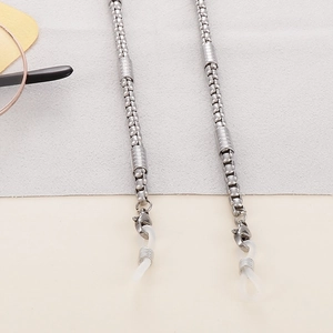 Detail of silver stainless steel eyeglass chain with lobster clasp and silicone loop