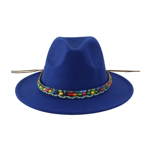 Detail of royal blue wool fedora featuring bohemian colorful beads and ethnic woven band