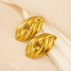 Close-up of hollowed twisted 18K gold-plated stainless steel earrings on silk