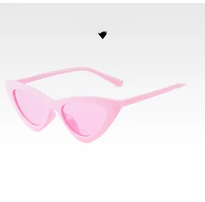 Detailed side view of pink cat eye sunglasses with translucent resin frames and lenses