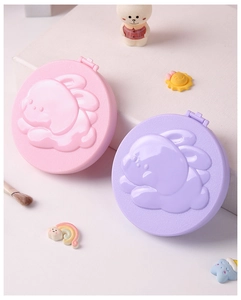 Detail view of pink and purple folding mirrors with 3D cartoon bunny relief pattern