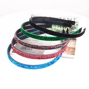 Close-up of colorful glitter headbands set with non-slip teeth and sparkling finish