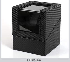 Detailed view of single automatic watch winder in sleek black carbon fiber finish