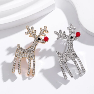 Sparkling gold and silver Christmas reindeer brooches with rhinestones on white background