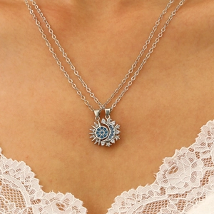 Close-up of magnetic sun and moon layered necklace with blue and white crystals
