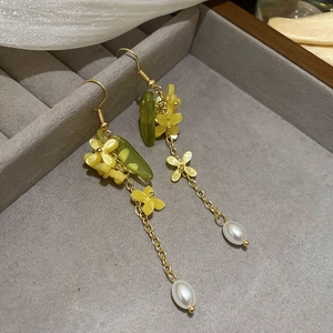 Elegant floral tassel earrings with yellow petals, green leaves and white teardrop pearls