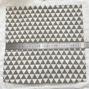 Detail showing the 45cm width measurement of a geometric cotton linen cushion cover