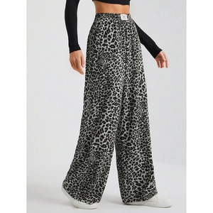 Detail of grey leopard print wide-leg pants showing fabric texture and elastic waistband