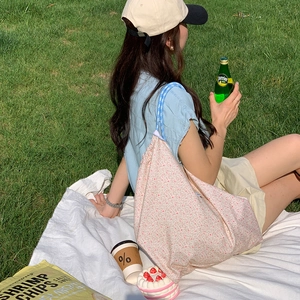 Floral canvas tote bag with pink flower pattern and blue straps for picnic outdoor use