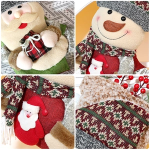 Close-up of knit fabric and plush textures on Santa and Snowman Christmas stockings