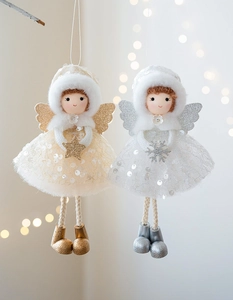Detail of plush Christmas angel ornaments with tulle skirts and sparkling wings