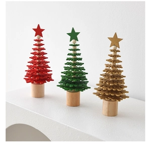 Three mini wooden Christmas trees in red green and gold with natural wood bases