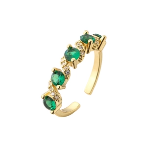 Gold-plated adjustable ring featuring five round green crystals and sparkling accents