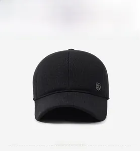 Front view of a thick black wool baseball cap for men with silver shield emblem