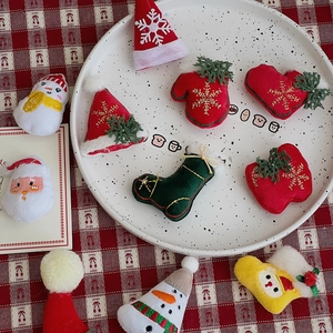 Detailed view of mini Christmas embroidery plush patches for DIY crafts and decor