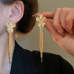 Elegant 18k gold plated flower earrings with white pearls and long hanging chain tassels