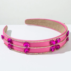 Detailed view of rose red satin headband with rhinestone rows and waterdrop gemstones